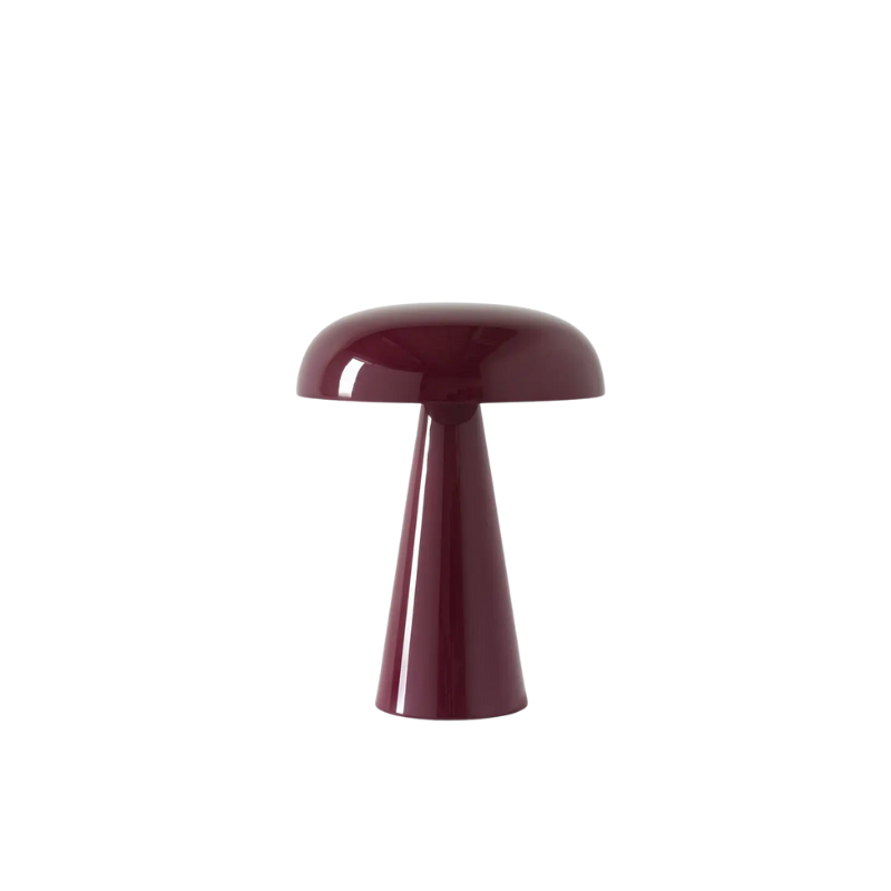 Match lighting to mood with Como SC53, a portable table lamp from Space Copenhagen. Crafted from anodized aluminum, Como’s sturdy base tapers up towards a soft curved, mushroom-shaped shade. This battery-powered lamp can operate for eleven hours at the highest setting, with an extra battery option that allows additional operating. It is easily recharged with a magnetic USB cable or a charging tray.