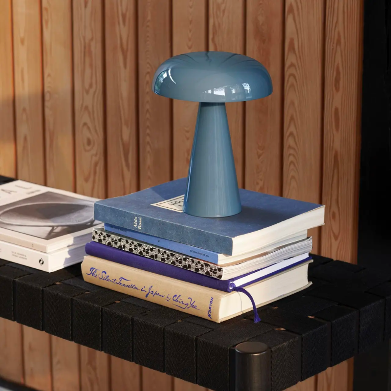 Como SC53, a portable table lamp from Space Copenhagen. Crafted from anodized aluminum, Como’s sturdy base tapers up towards a softy curved, mushroom-shaped shade. This battery-powered lamp can operate for eleven hours at the highest setting, with an extra battery option that allows additional operating. It is easily recharged with a magnetic USB cable or a charging tray.