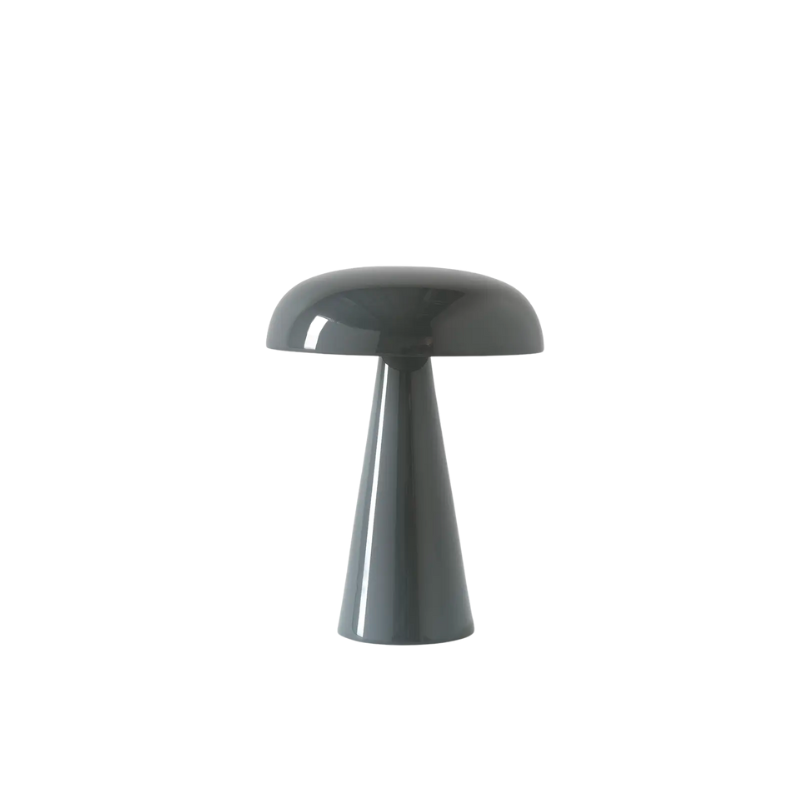 Match lighting to mood with Como SC53, a portable table lamp from Space Copenhagen. Crafted from anodized aluminum, Como’s sturdy base tapers up towards a soft curved, mushroom-shaped shade. This battery-powered lamp can operate for eleven hours at the highest setting, with an extra battery option that allows additional operating. It is easily recharged with a magnetic USB cable or a charging tray.