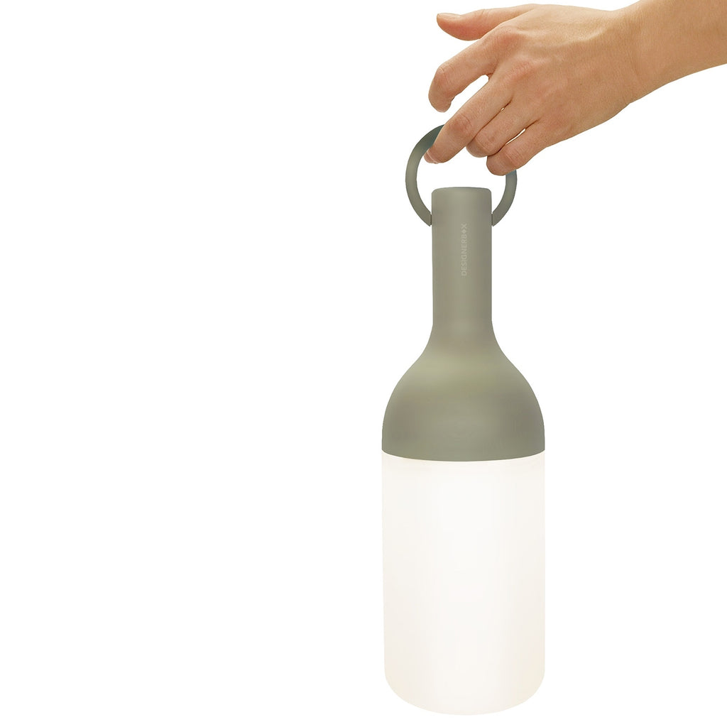 Get ready for the great outdoors with the ELO Rechargeable LED Portable Table Lamp from DesignerBox. Created with an eye toward French design by Bina Baitel, it starts with a handle that flares out into a dome shape, seating weatherproof and dimmable LED lamping inside a cylindrical, translucent shade that blocks excess glare, transforming it into a pleasant glow.