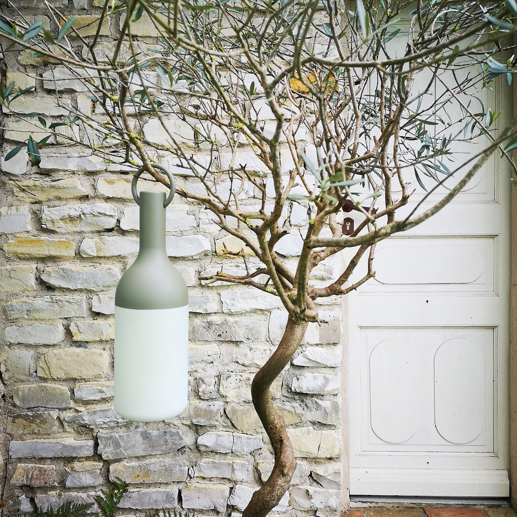Get ready for the great outdoors with the ELO Rechargeable LED Portable Table Lamp from DesignerBox. Created with an eye toward French design by Bina Baitel, it starts with a handle that flares out into a dome shape, seating weatherproof and dimmable LED lamping inside a cylindrical, translucent shade that blocks excess glare, transforming it into a pleasant glow.