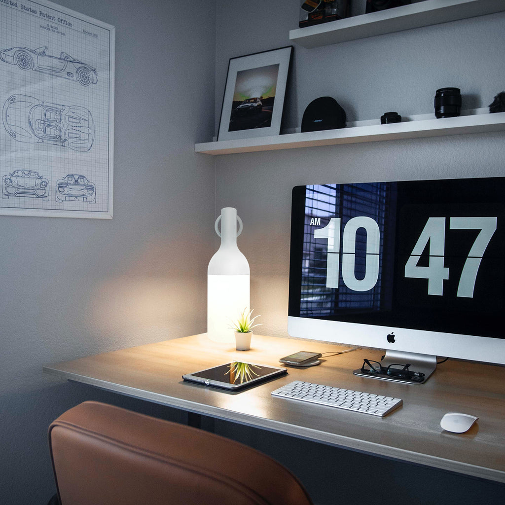 Get ready for the great outdoors with the ELO Rechargeable LED Portable Table Lamp from DesignerBox. Created with an eye toward French design by Bina Baitel, it starts with a handle that flares out into a dome shape, seating weatherproof and dimmable LED lamping inside a cylindrical, translucent shade that blocks excess glare, transforming it into a pleasant glow.