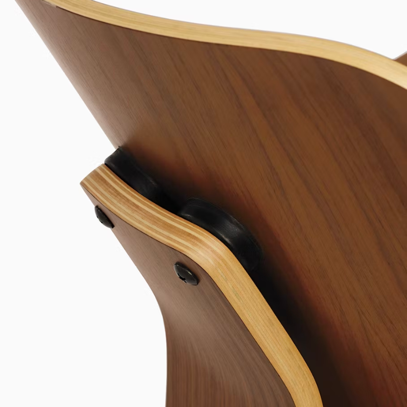 The Eames Molded Plywood Lounge Chair Wood Base (LCW) from Herman Miller in a detailed photograph.
