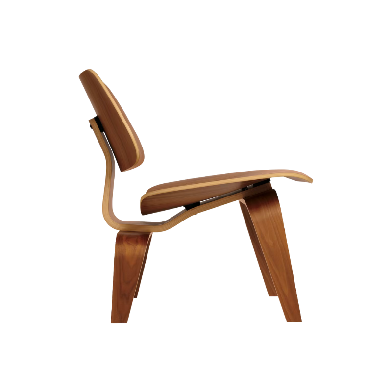 The Eames Molded Plywood Lounge Chair Wood Base (LCW) from Herman Miller in walnut in a profile shot.