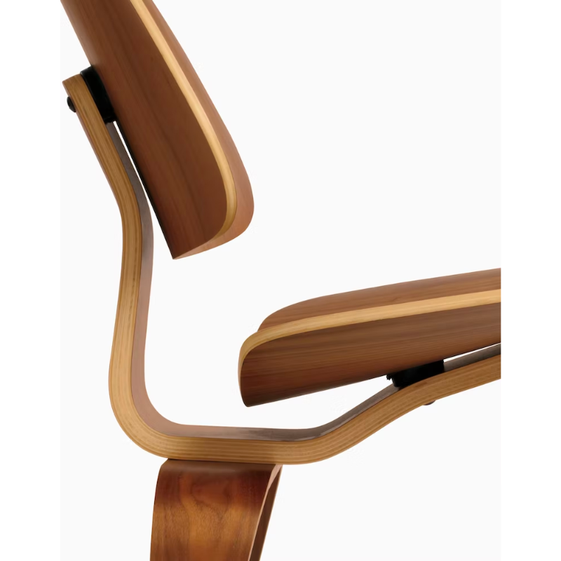 The Eames Molded Plywood Lounge Chair Wood Base (LCW) from Herman Miller in a side detail shot.