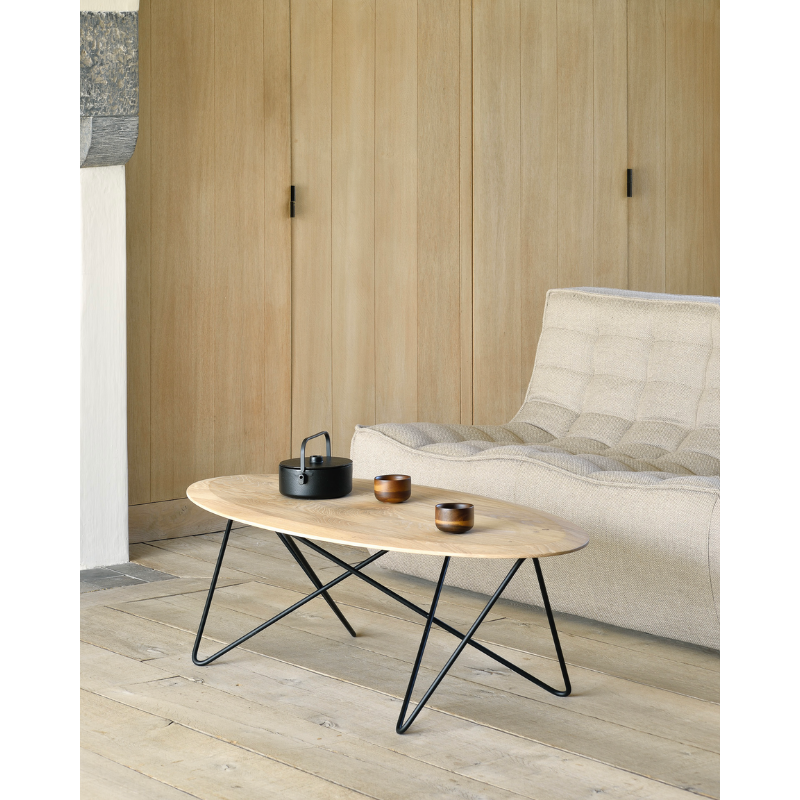 Ethnicraft's Orb is a dynamic coffee table. The shape of the top is thin on the sides and thicker in the middle. The metal legs are built in a way that they create an infinite movement, no beginning, no end, without interruption. A beautiful contrast of different lines that come together perfectly in a coffee table full of character.
