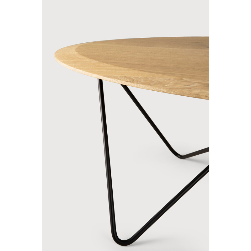 Ethnicraft's Orb is a dynamic coffee table. The shape of the top is thin on the sides and thicker in the middle. The metal legs are built in a way that they create an infinite movement, no beginning, no end, without interruption. A beautiful contrast of different lines that come together perfectly in a coffee table full of character.
