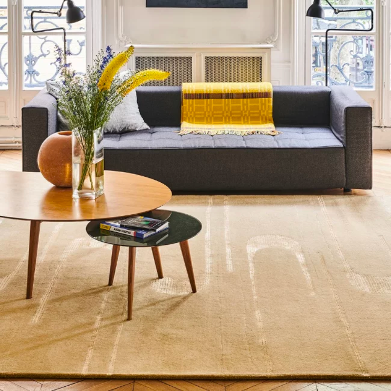 An intriguing piece deserving of a frame. In the Modulation Area Rug from Toulemonde Bochart, Réda Amalou blurs the lines between art and design as he presents a composition that moves through his body of work. This rug takes you on a journey with its movement, hooking shapes over each other with fine linear accents replicating their pleasant color. Using wool and art silk, the piece is hand-tufted for a comfortable and textured presence.