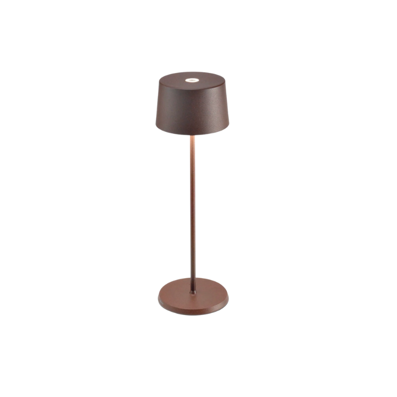 Accent your home with the simple, yet beautiful form of the Olivia Rechargeable LED Table Lamp from Ai Lati Lights. Composed throughout of die-cast aluminum, this small and expressive piece unites the space around it with a hefty layer of light. 