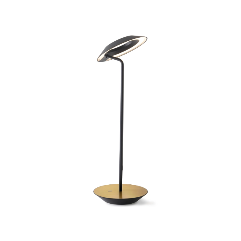 A simultaneously retro and modern desk lamp that combines elegance and inviting warmth. The Royyo Desk Lamp by Koncept will bring whimsy and charm to your desk, as well as super useful and energy-efficient LED illumination. Inventive simplicity is the value that holds together each piece of the desk lamp’s aesthetic, with a somewhat conical shade held at a distinct angle by a thin Aluminum stem. This is contrasted neatly by a distinctively shaped base.