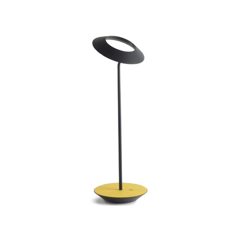 A simultaneously retro and modern desk lamp that combines elegance and inviting warmth. The Royyo Desk Lamp by Koncept will bring whimsy and charm to your desk, as well as super useful and energy-efficient LED illumination. Inventive simplicity is the value that holds together each piece of the desk lamp’s aesthetic, with a somewhat conical shade held at a distinct angle by a thin Aluminum stem. This is contrasted neatly by a distinctively shaped base.