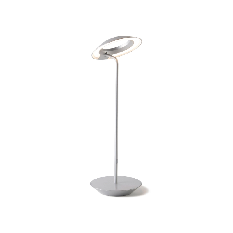A simultaneously retro and modern desk lamp that combines elegance and inviting warmth. The Royyo Desk Lamp by Koncept will bring whimsy and charm to your desk, as well as super useful and energy-efficient LED illumination. Inventive simplicity is the value that holds together each piece of the desk lamp’s aesthetic, with a somewhat conical shade held at a distinct angle by a thin Aluminum stem. This is contrasted neatly by a distinctively shaped base.