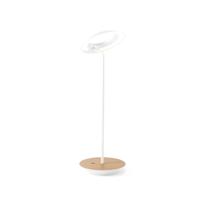 A simultaneously retro and modern desk lamp that combines elegance and inviting warmth. The Royyo Desk Lamp by Koncept will bring whimsy and charm to your desk, as well as super useful and energy-efficient LED illumination. Inventive simplicity is the value that holds together each piece of the desk lamp’s aesthetic, with a somewhat conical shade held at a distinct angle by a thin Aluminum stem. This is contrasted neatly by a distinctively shaped base.