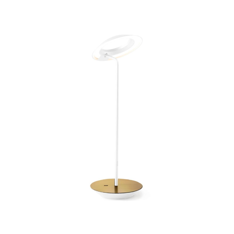 A simultaneously retro and modern desk lamp that combines elegance and inviting warmth. The Royyo Desk Lamp by Koncept will bring whimsy and charm to your desk, as well as super useful and energy-efficient LED illumination. Inventive simplicity is the value that holds together each piece of the desk lamp’s aesthetic, with a somewhat conical shade held at a distinct angle by a thin Aluminum stem. This is contrasted neatly by a distinctively shaped base.