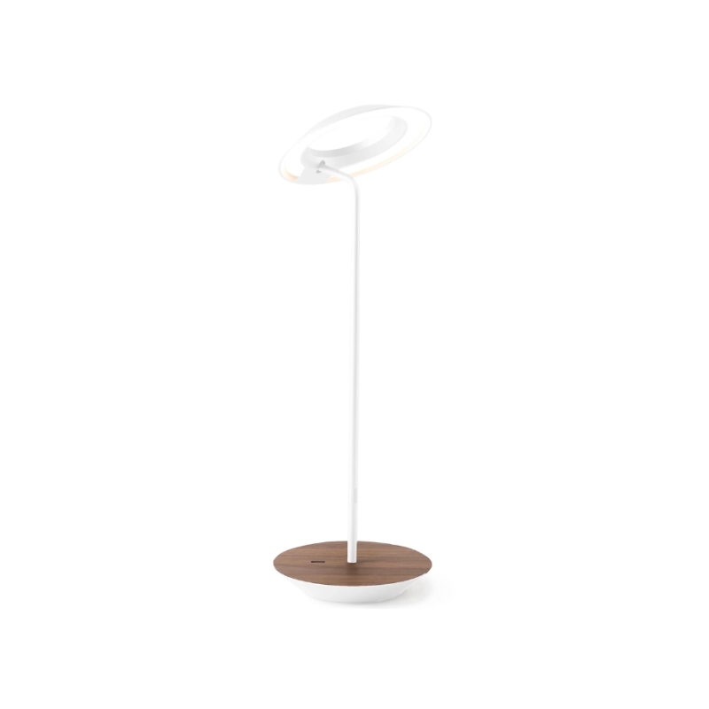 A simultaneously retro and modern desk lamp that combines elegance and inviting warmth. The Royyo Desk Lamp by Koncept will bring whimsy and charm to your desk, as well as super useful and energy-efficient LED illumination. Inventive simplicity is the value that holds together each piece of the desk lamp’s aesthetic, with a somewhat conical shade held at a distinct angle by a thin Aluminum stem. This is contrasted neatly by a distinctively shaped base.
