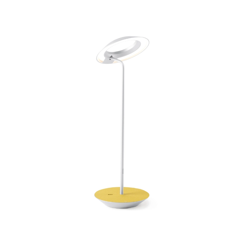 A simultaneously retro and modern desk lamp that combines elegance and inviting warmth. The Royyo Desk Lamp by Koncept will bring whimsy and charm to your desk, as well as super useful and energy-efficient LED illumination. Inventive simplicity is the value that holds together each piece of the desk lamp’s aesthetic, with a somewhat conical shade held at a distinct angle by a thin Aluminum stem. This is contrasted neatly by a distinctively shaped base.