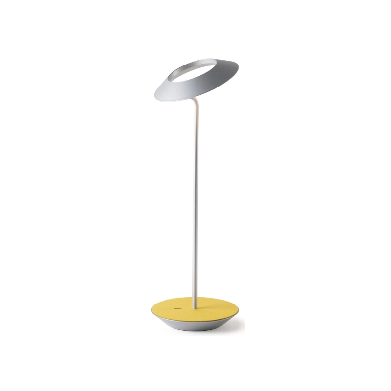 A simultaneously retro and modern desk lamp that combines elegance and inviting warmth. The Royyo Desk Lamp by Koncept will bring whimsy and charm to your desk, as well as super useful and energy-efficient LED illumination. Inventive simplicity is the value that holds together each piece of the desk lamp’s aesthetic, with a somewhat conical shade held at a distinct angle by a thin Aluminum stem. This is contrasted neatly by a distinctively shaped base.
