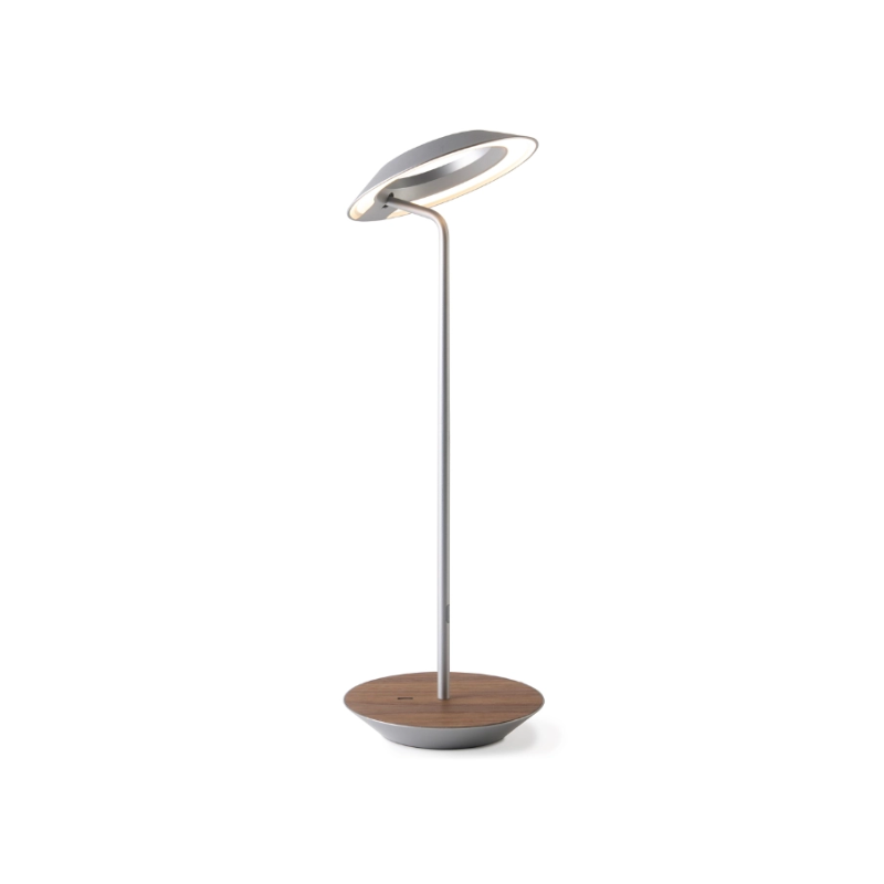 A simultaneously retro and modern desk lamp that combines elegance and inviting warmth. The Royyo Desk Lamp by Koncept will bring whimsy and charm to your desk, as well as super useful and energy-efficient LED illumination. Inventive simplicity is the value that holds together each piece of the desk lamp’s aesthetic, with a somewhat conical shade held at a distinct angle by a thin Aluminum stem. This is contrasted neatly by a distinctively shaped base.