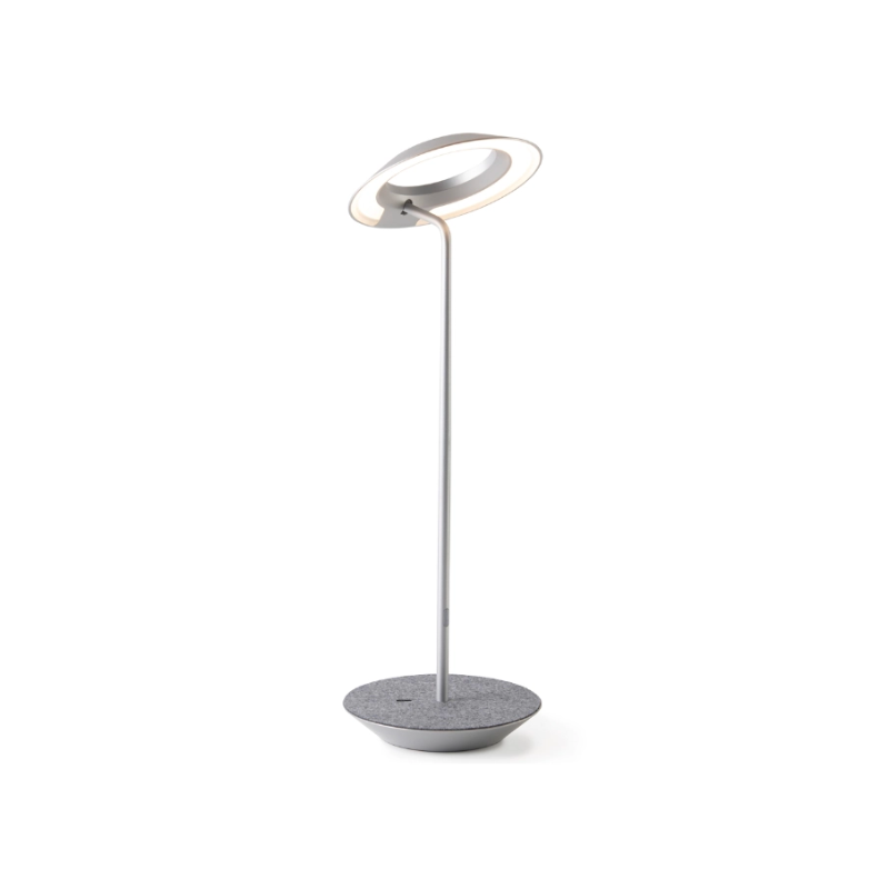 A simultaneously retro and modern desk lamp that combines elegance and inviting warmth. The Royyo Desk Lamp by Koncept will bring whimsy and charm to your desk, as well as super useful and energy-efficient LED illumination. Inventive simplicity is the value that holds together each piece of the desk lamp’s aesthetic, with a somewhat conical shade held at a distinct angle by a thin Aluminum stem. This is contrasted neatly by a distinctively shaped base.