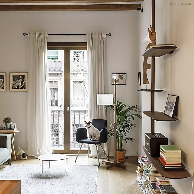The Unica Ceiling Floating Shelving System from Nomon lends an airy, sculptural simplicity to its surroundings. An impeccably engineered Andres Martinez design that descends from above via a sleek downrod of solid walnut, it extends a series of slender, strong shelves with a smooth walnut veneer. 