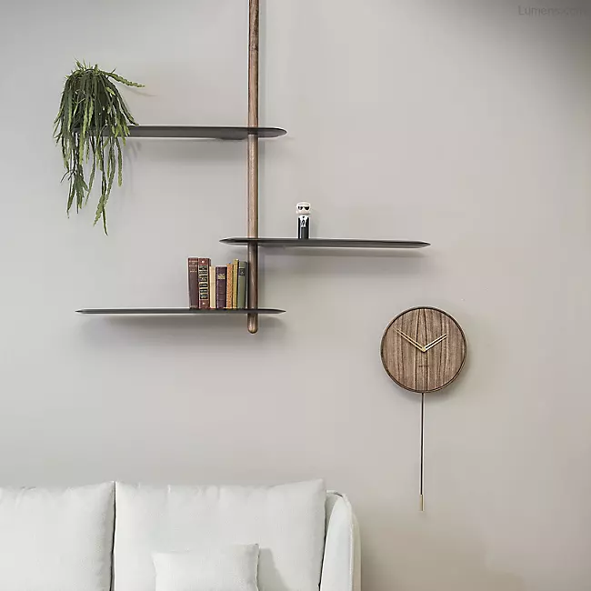 The Unica Ceiling Floating Shelving System from Nomon lends an airy, sculptural simplicity to its surroundings. An impeccably engineered Andres Martinez design that descends from above via a sleek downrod of solid walnut, it extends a series of slender, strong shelves with a smooth walnut veneer. 