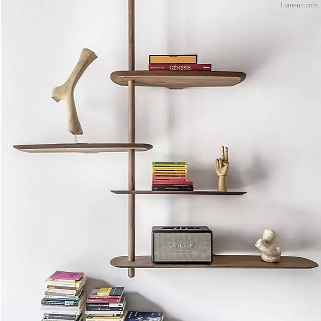 The Unica Ceiling Floating Shelving System from Nomon lends an airy, sculptural simplicity to its surroundings. An impeccably engineered Andres Martinez design that descends from above via a sleek downrod of solid walnut, it extends a series of slender, strong shelves with a smooth walnut veneer. 