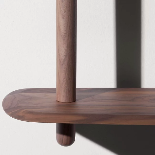 Rise in style with the smooth surfaces and open expressiveness of the Unica Floor Shelving System from Nomon. A smooth design from the mind of Andres Martinez, it ascends along a single solid walnut rod that telescopes out from a narrower point, seating alternating fixed and “floating” shelves with a smooth walnut veneer along its length. 