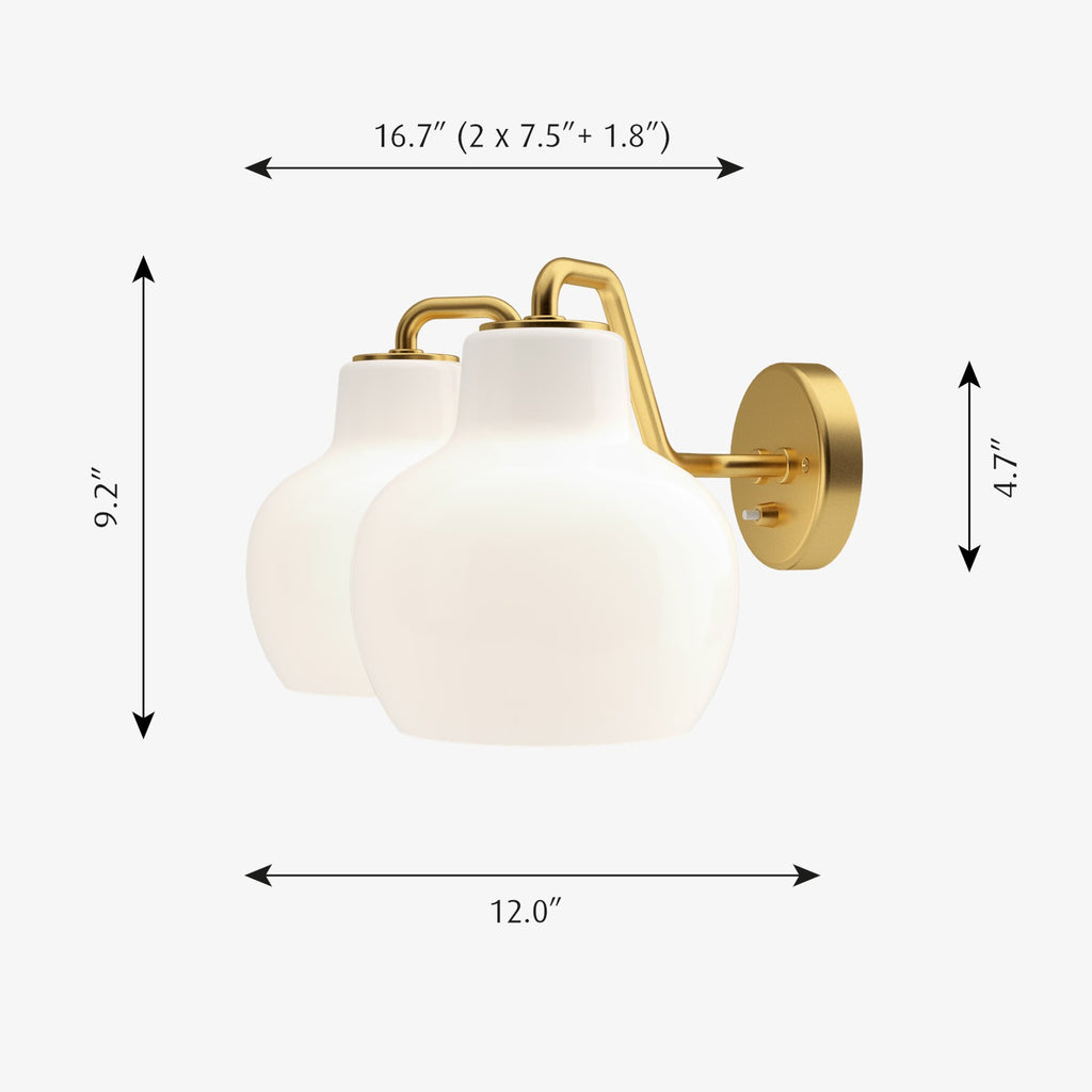 The VL Ring Crown wall sconce by Louis Poulsen has a characteristically organic form that emits light directed primarily downwards, while the opal glass provides a comfortable and uniform illumination of the area around the fixture.