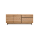 The Wave Sideboard by Ethnicraft features contoured cabinet doors and a distinguished shape to the feet. Made of solid wood, this cabinet’s doors and drawers have no handles and feature a soft closing mechanism.