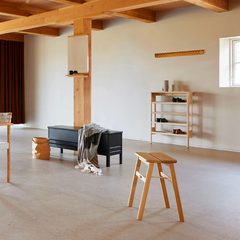 An updated version of the classic stowaway bench where functionality meets clean form. 
