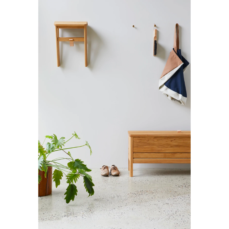 An updated version of the classic stowaway bench where functionality meets clean form. 