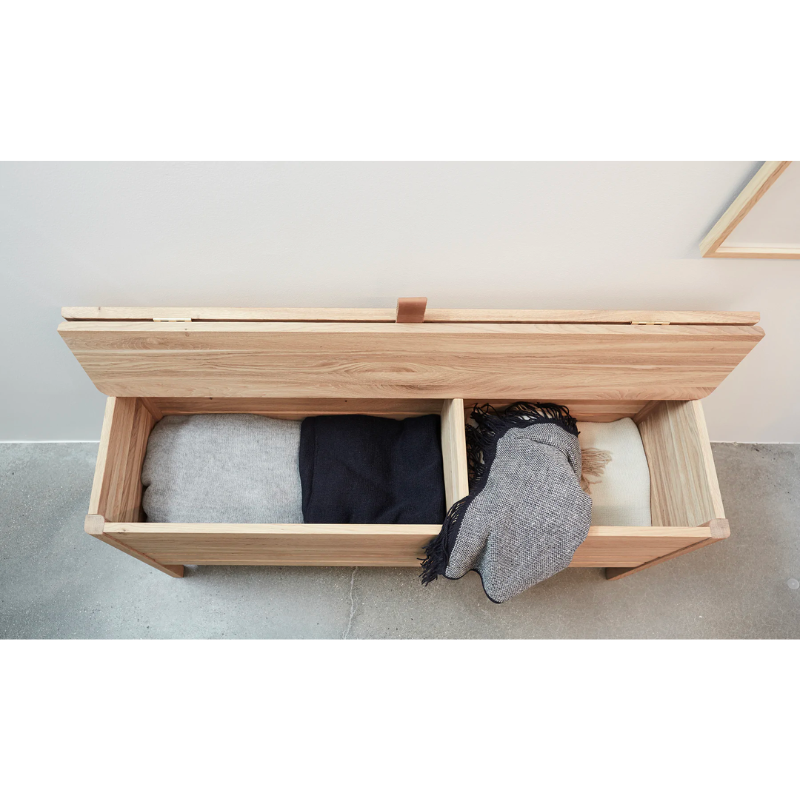 An updated version of the classic stowaway bench where functionality meets clean form. 