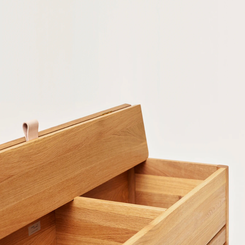 An updated version of the classic stowaway bench where functionality meets clean form. 