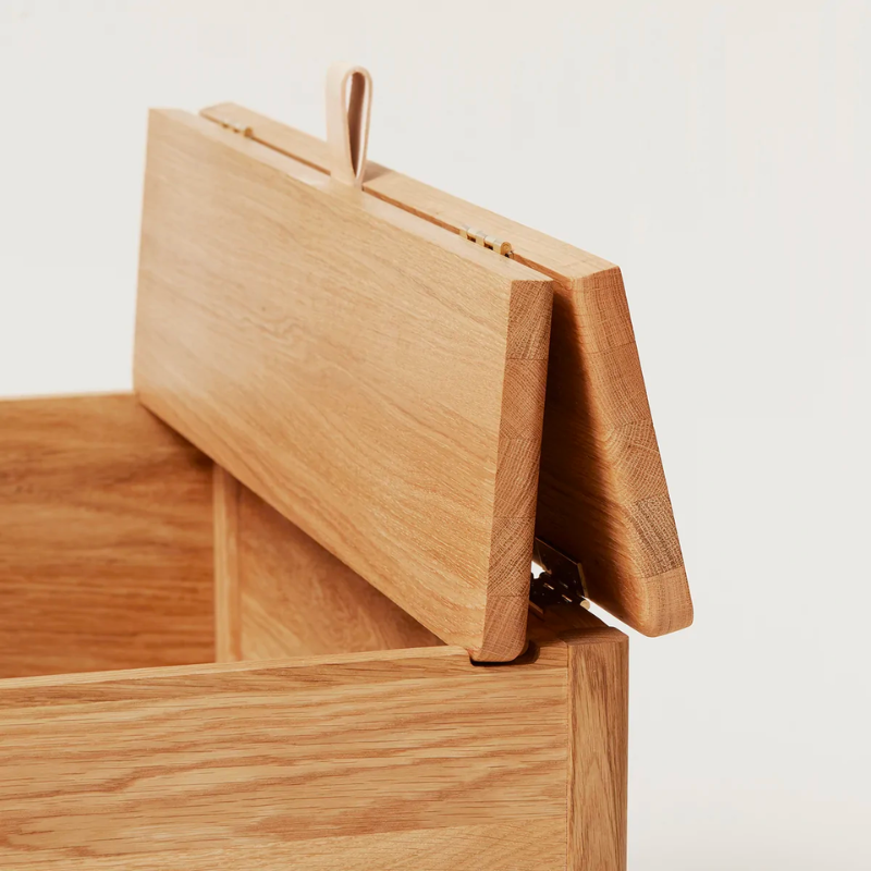 An updated version of the classic stowaway bench where functionality meets clean form. 