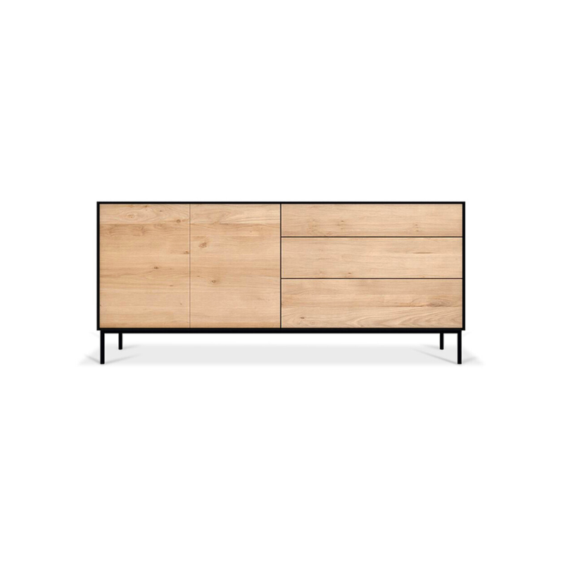 The Blackbird sideboard by Ethnicraft brings together opposing elements, combining soft round legs and eye-catching graphic lines into a light and airy design. Designed by Alain van Havre.