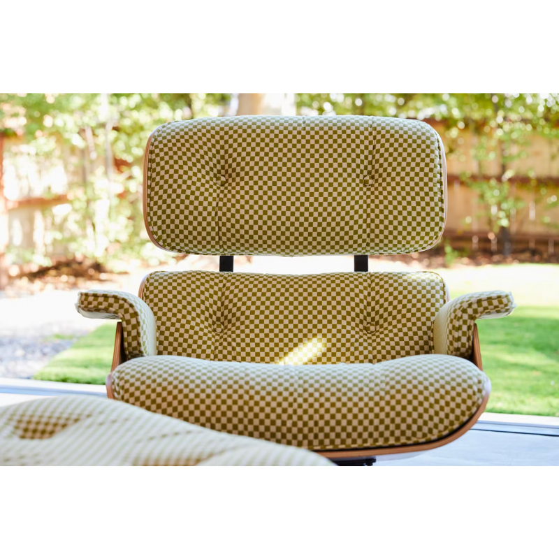 Chair and ottoman comprised of molded wood shells filled with removable cushions. Stamped with a medallion on the chair’s underside to signify authenticity. Suited for living spaces, reception areas and executive offices.