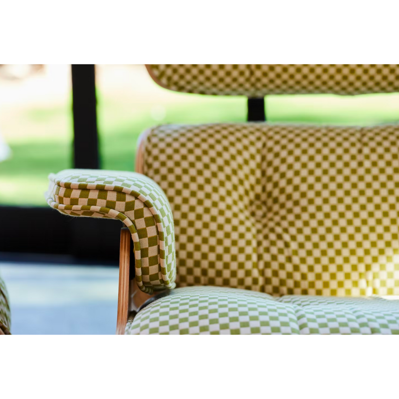 Chair and ottoman comprised of molded wood shells filled with removable cushions. Stamped with a medallion on the chair’s underside to signify authenticity. Suited for living spaces, reception areas and executive offices.