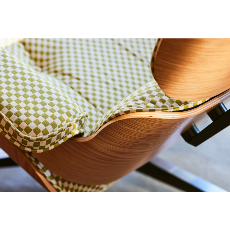 Chair and ottoman comprised of molded wood shells filled with removable cushions. Stamped with a medallion on the chair’s underside to signify authenticity. Suited for living spaces, reception areas and executive offices.