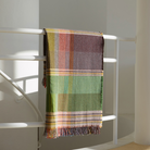 Woven in merino lambswool, Wallace & Sewell's Pinstripe throws combine bold-colored blocks with fine, detailed vertical stripes. This double-sided design also has a contrasting pixelated border and makes a stunning addition to a room.