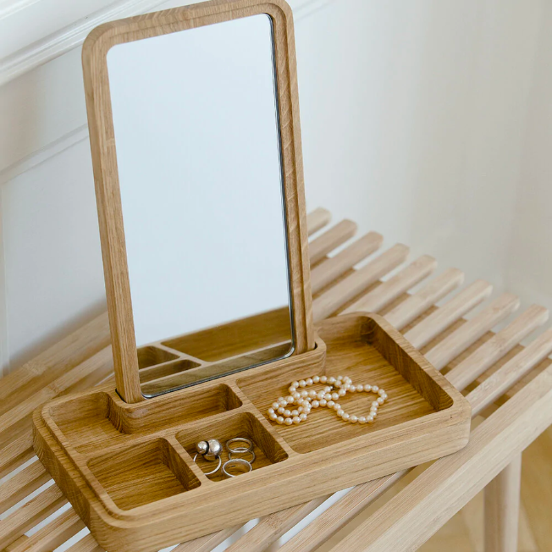 Mirror Box by Spring Copenhagen is a smart design that scores high on both aesthetics and functionality. The lid conceals a mirror, which you can place upright in the box. The box itself is split into smaller compartments, which are ideal for items such as jewelry, hair bands, keys, and cards. 