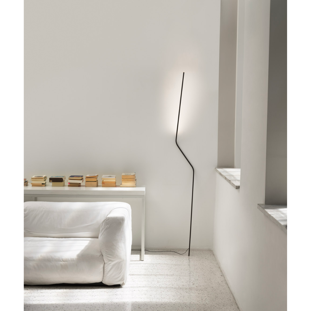 Make a statement or blend in, the NEO LED Floor Lamp, designed by Bernhard Ossan for Nemo, presents a refined fixture for modern spaces. Composed of a single steel beam, this fixture rests against the wall as a slender vertical structure.