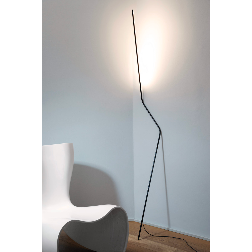 Make a statement or blend in, the NEO LED Floor Lamp, designed by Bernhard Ossan for Nemo, presents a refined fixture for modern spaces. Composed of a single steel beam, this fixture rests against the wall as a slender vertical structure.
