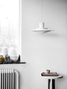 The P376 pendant lamp is a perfect example of subtle architectural slant on design. Originally conceived in 1963 by Danish architects Kastholm & Fabricius and relaunched by &Tradition in 2019, the P376 features five concentric shades that create gradations of curves towards the middle of the lamp to emit a soft, diffused light. The discrete placement of the shades and the silky aluminium finish culminate in a cohesive expression that’s both iconic and enthralling. 
