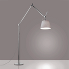 The Tolomeo Mega Floor Lamp from Artemide in pale gray with a 14-inch shade in a dining space.