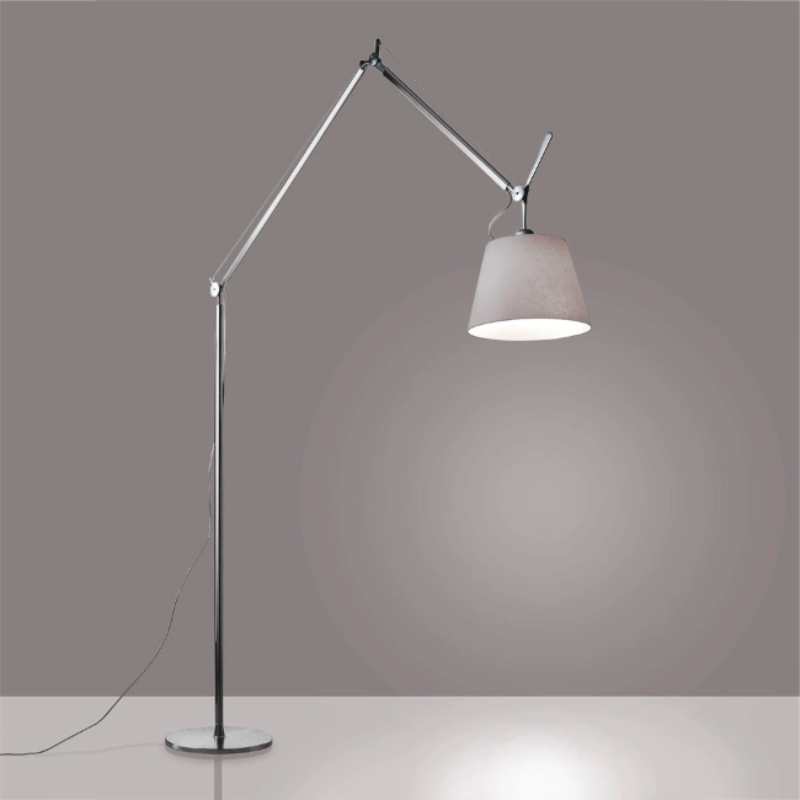 The Tolomeo Mega Floor Lamp from Artemide in pale gray with a 14-inch shade in a dining space.