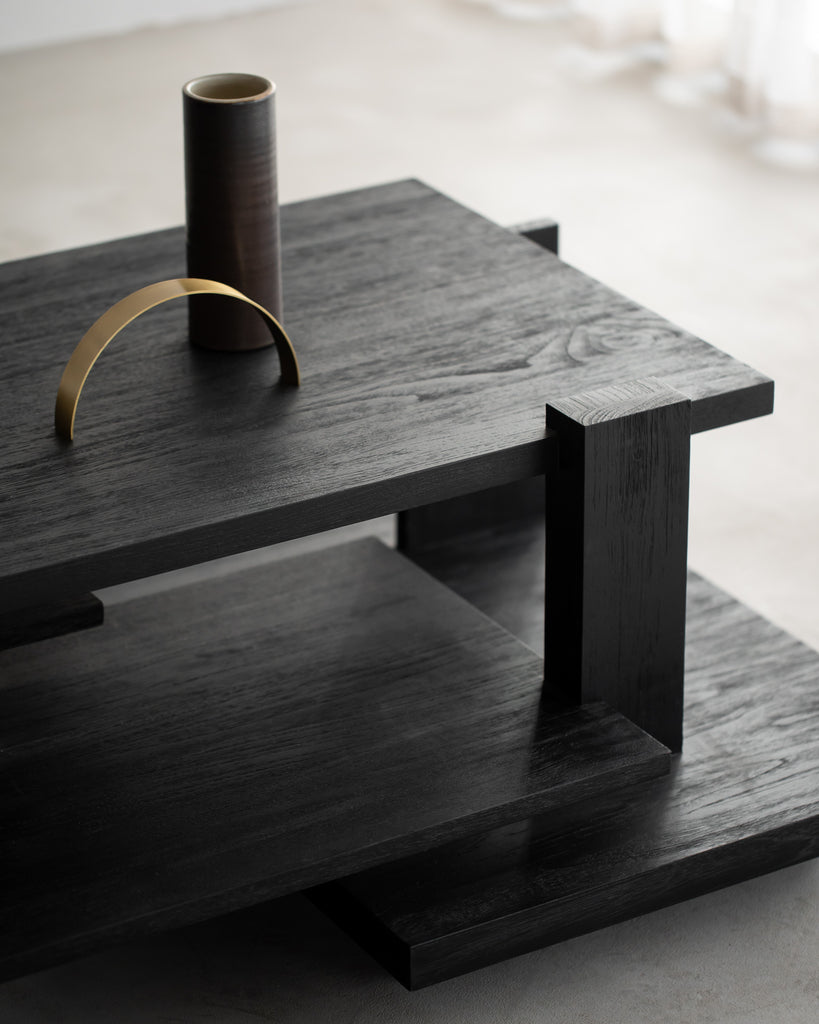 Inspired by the Dutch architectural movement de Stijl, the Abstract coffee table is not only centred around style, but also purpose. With its contemporary black finish discover new proportions and interest from every angle. Designed by Alain van Havre.
