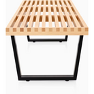 The Nelson Platform Bench from Herman Miller in maple with the wood base in a detailed shot.