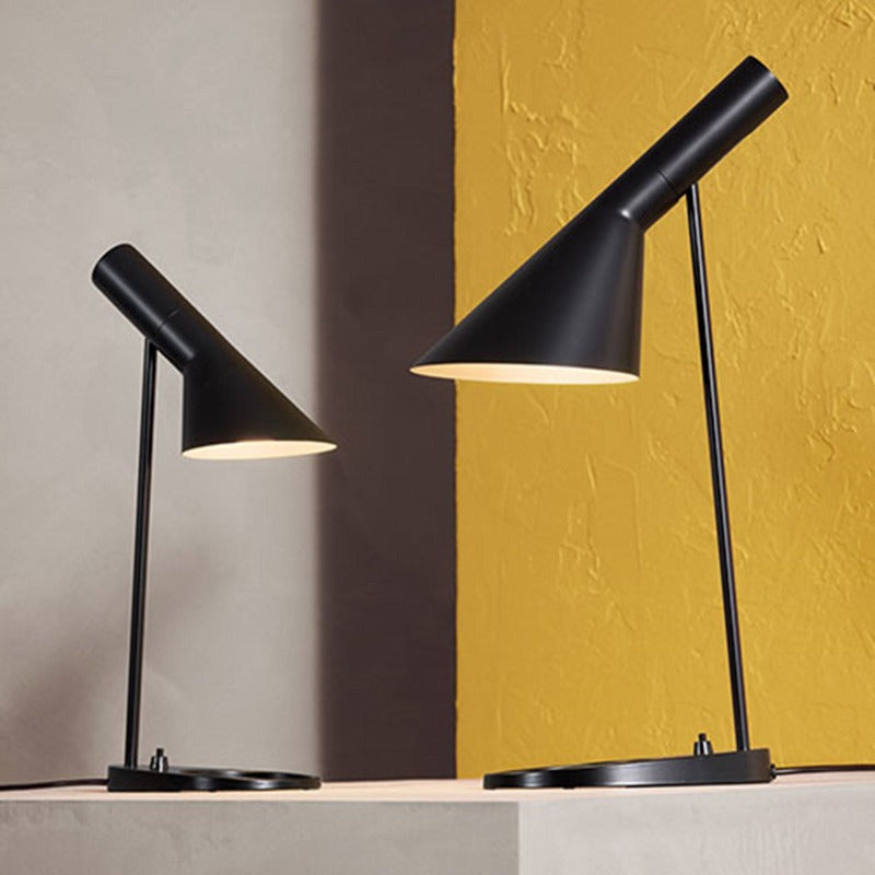 Arne Jacobsen designed the AJ Lamp for the SAS Royal Hotel in Copenhagen (Radisson Collection) in 1957. The profile of the AJ Lamp with its straight lines and its combination of oblique and right angles is not only seen as a formal parallel to the profile of the Series 3300 seats but also to the geometric profiles of his buildings.