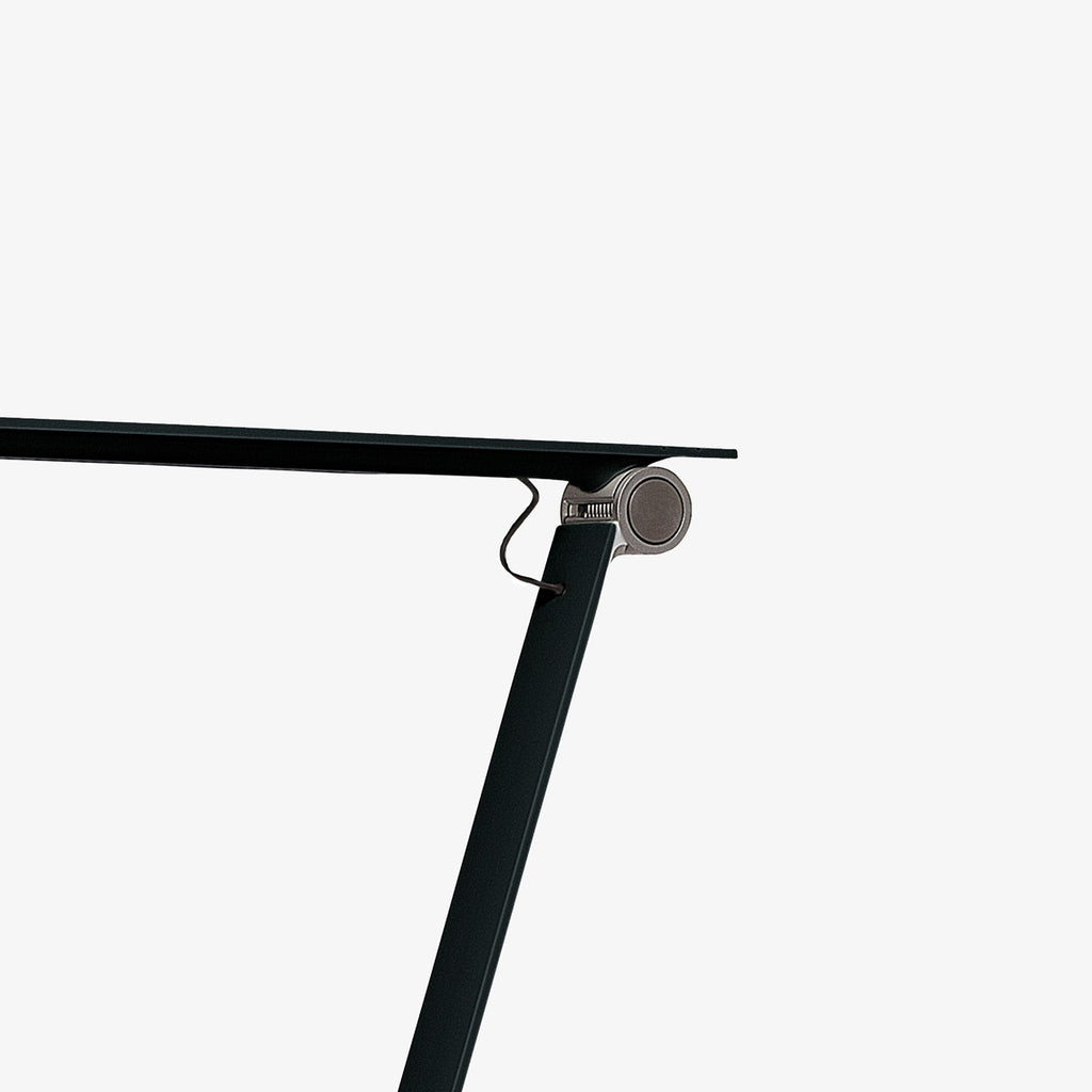 The NJP Table Lamp is a new interpretation of a classic architect lamp designed by Nendo design studio of Japan and designer Oki Sato. Its simple and honest look bares the lamp's functional components and makes it self-explanatory in its expression. The lamp features a timer function that can be set to turn the lamp off at after four or eight hours. Its ergonomic design and simple mechanical system provides great freedom of movement, so that light can always be set in the ideal position in the workspace.