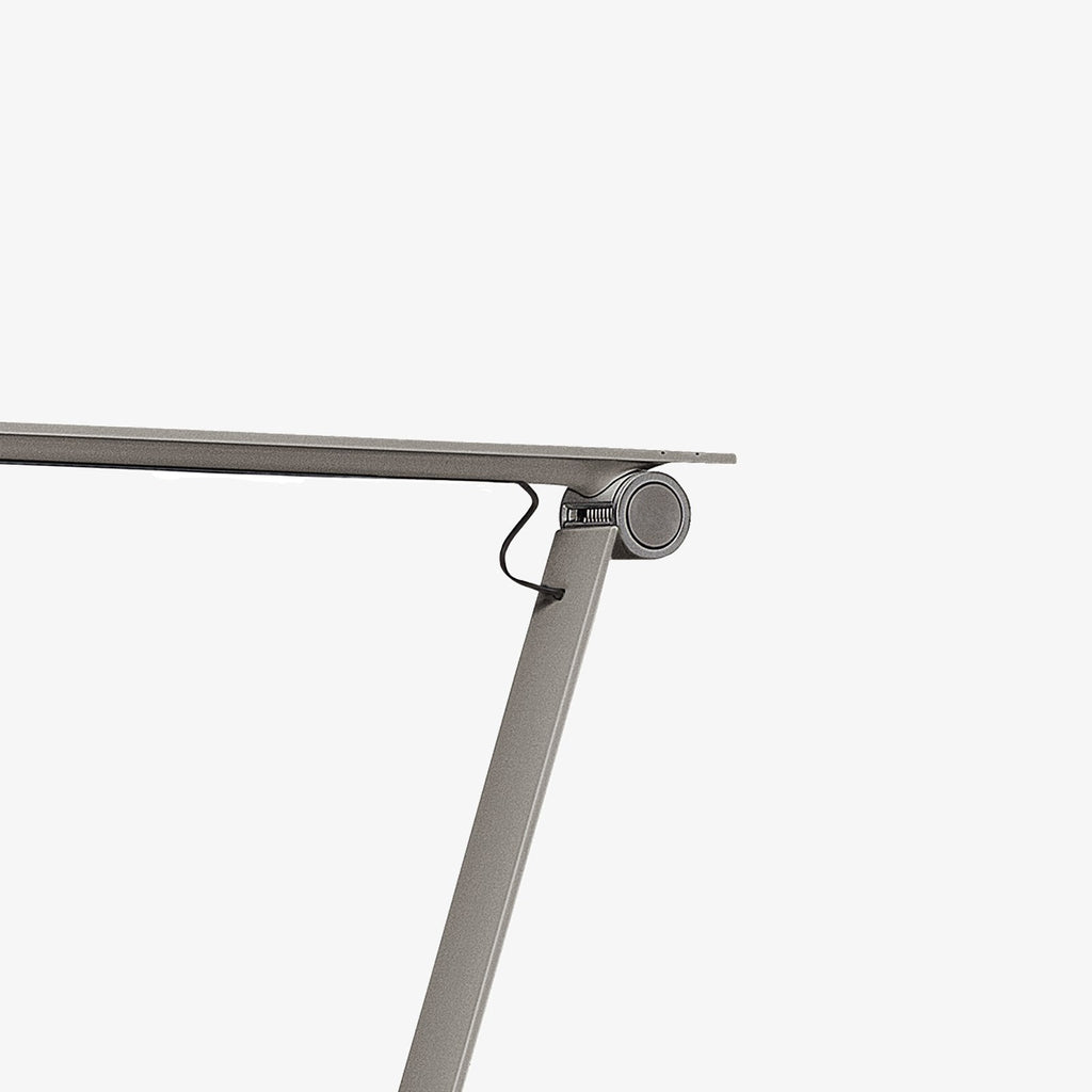 The NJP Table Lamp is a new interpretation of a classic architect lamp designed by Nendo design studio of Japan and designer Oki Sato. Its simple and honest look bares the lamp's functional components and makes it self-explanatory in its expression. The lamp features a timer function that can be set to turn the lamp off at after four or eight hours. Its ergonomic design and simple mechanical system provides great freedom of movement, so that light can always be set in the ideal position in the workspace.